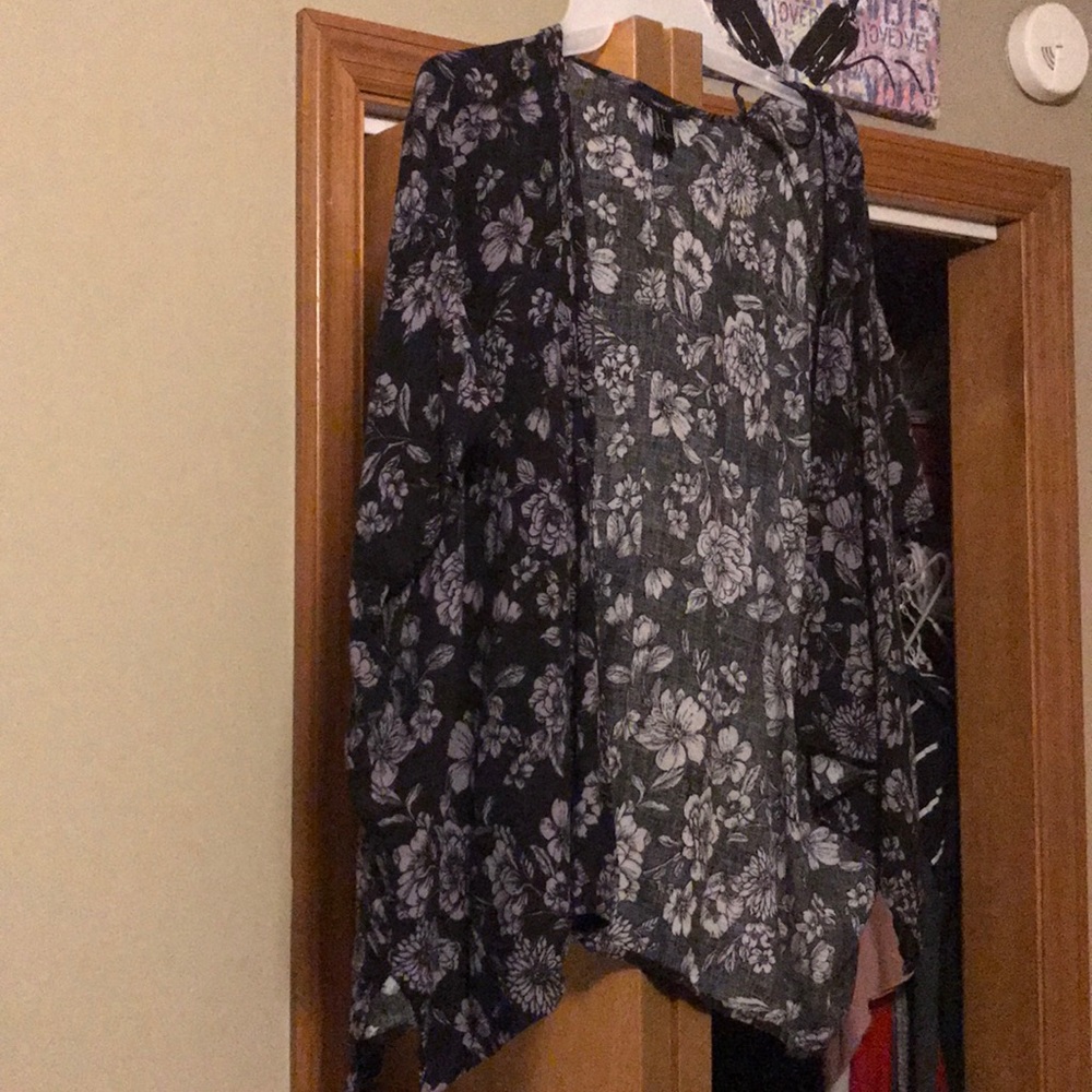 Navy blue cardigan with light blue/grayish flowers